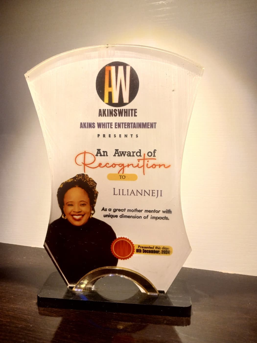 Akins White Entertainment Award of Recognition presented to Lilian Nneji