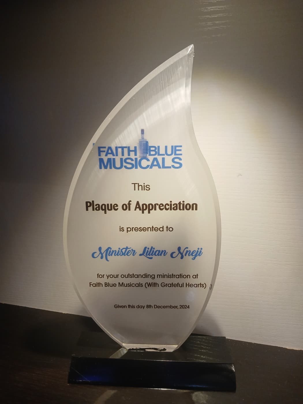 Faith Blue Musicals Plaque of Appreciation presented to Minister Lilian Nneji