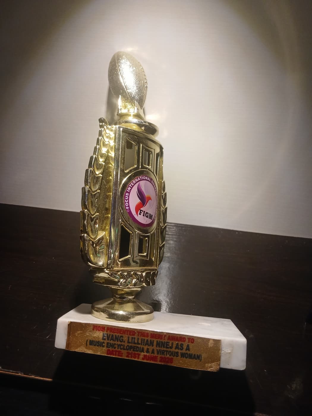Focus International Gospel Music merit award trophy presented to Evang. Lillian Nneji