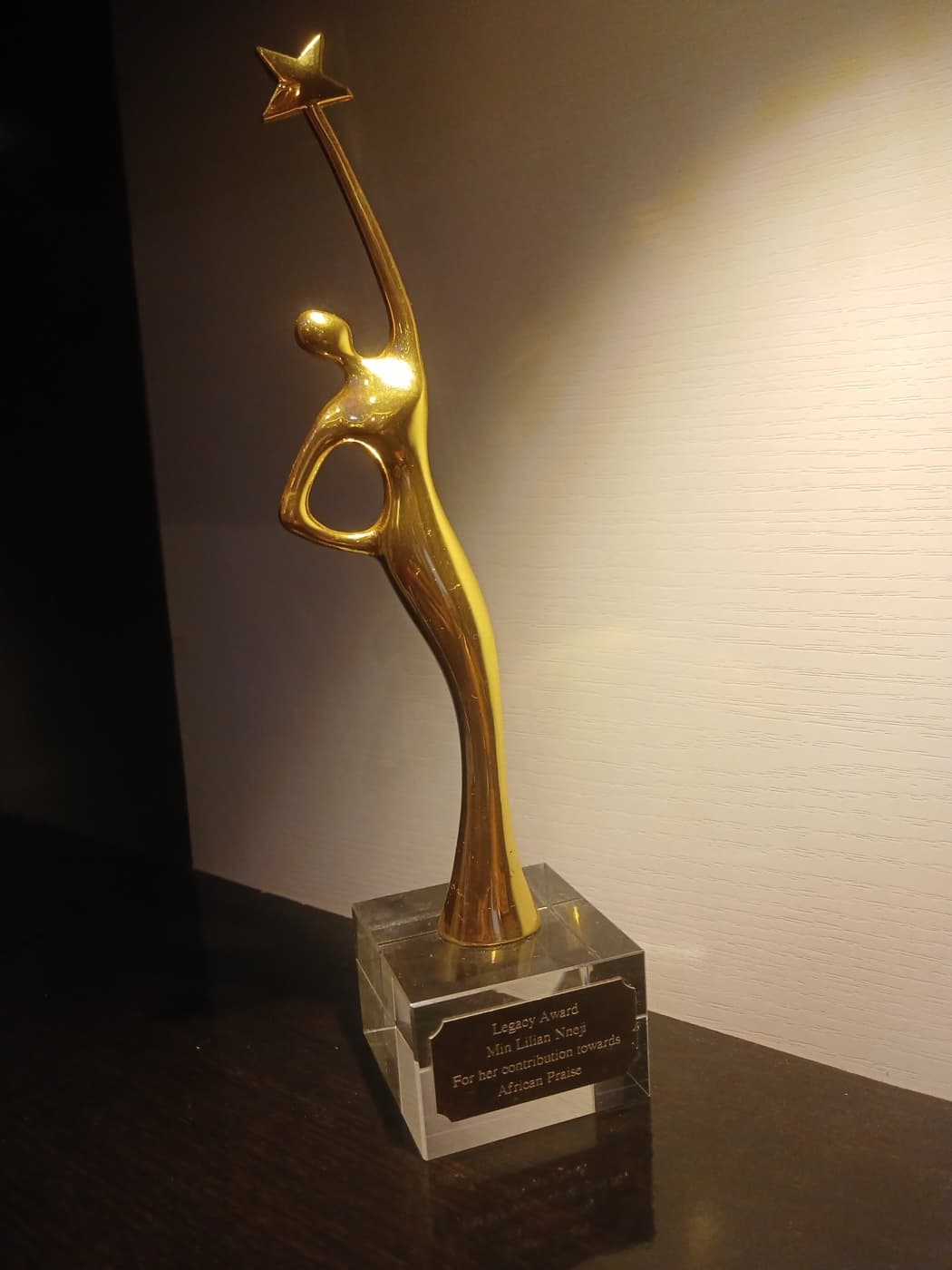 Gold Legacy Award sculpture presented to Min. Lilian Nneji for her contribution towards African Praise
