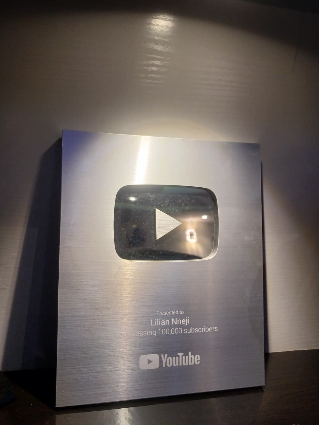 YouTube Silver Play Button presented to Lilian Nneji for passing 100,000 subscribers